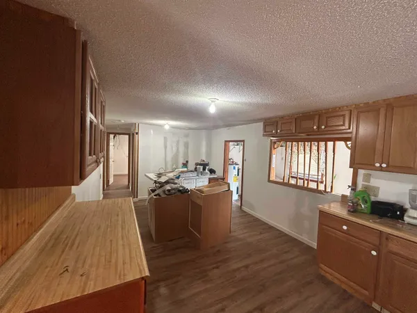 a living room with furniture window and wooden floor