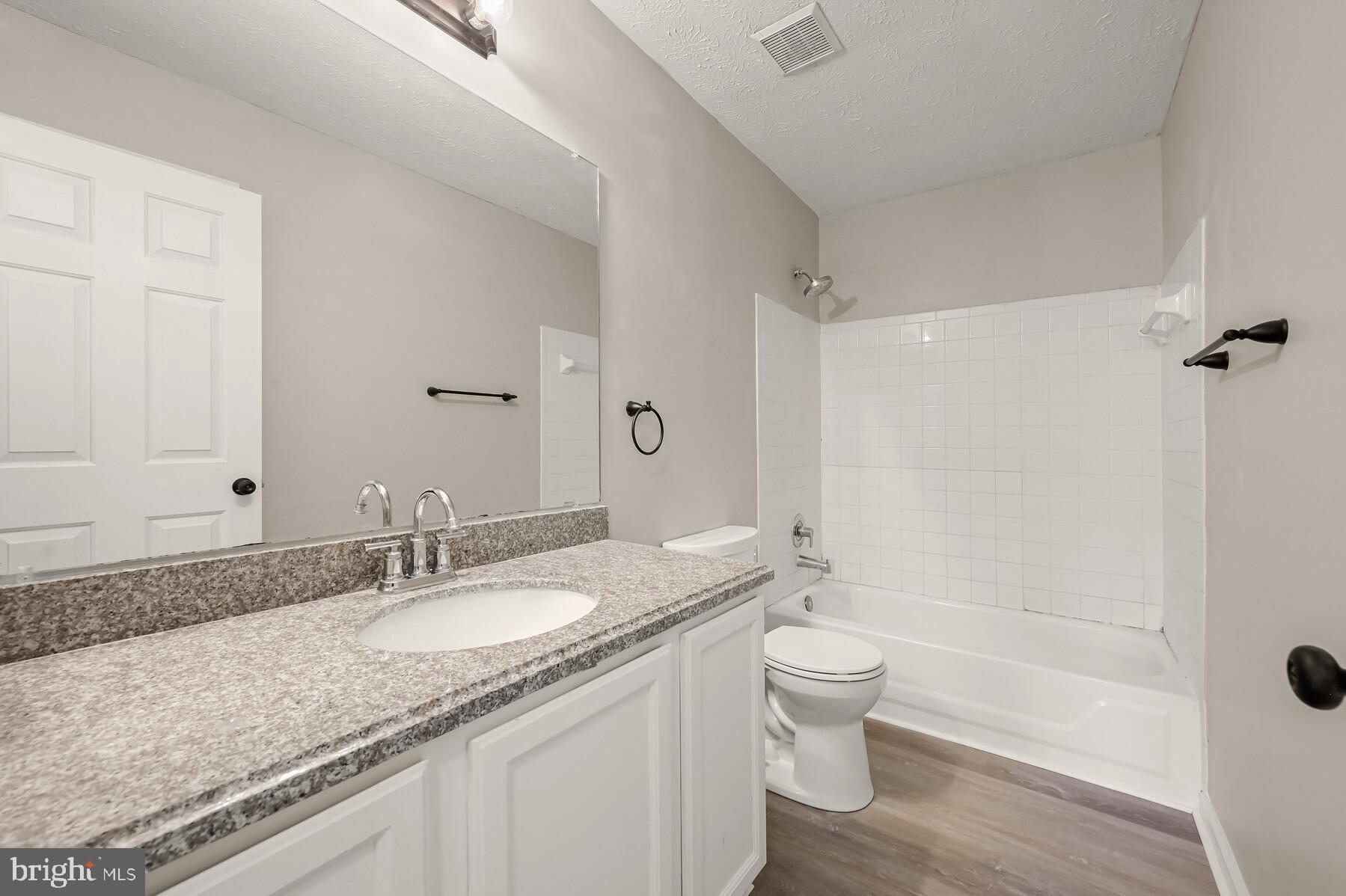 6814 King Road Boonsboro, MD 21713 - Photo 34 of 40 Upper Level Hallway Full bath w/ new LVP