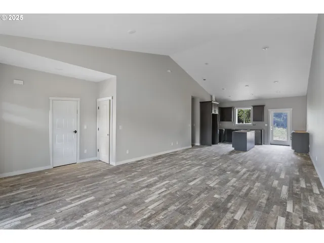 a view of a kitchen with wooden floor