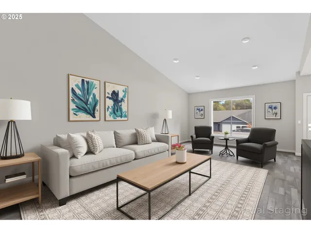 a living room with furniture a rug and a lamp