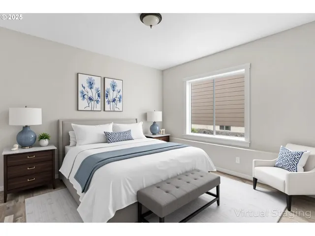 a bedroom with a bed a couch and a window