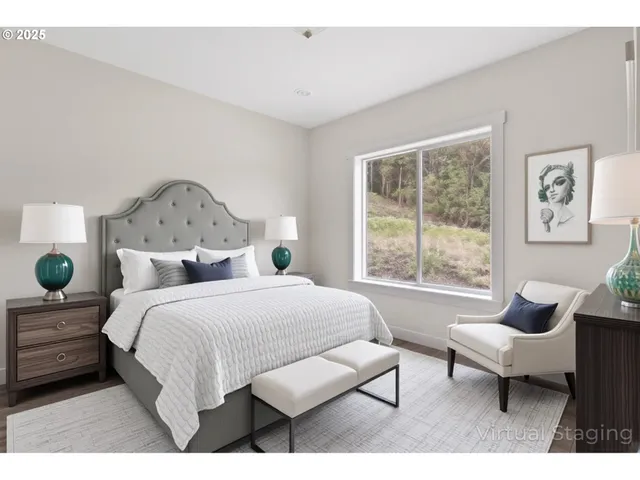 a spacious bedroom with a bed a couch and a window