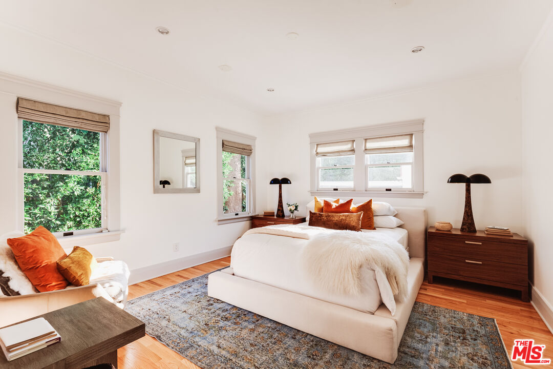 5850 Foothill Drive Los Angeles, CA 90068 - Photo 12 of 33 a bedroom with a bed and wooden floor