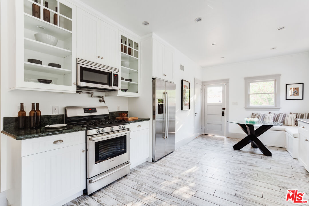 5850 Foothill Drive Los Angeles, CA 90068 - Photo 14 of 33 a kitchen with stainless steel appliances a stove microwave and a refrigerator
