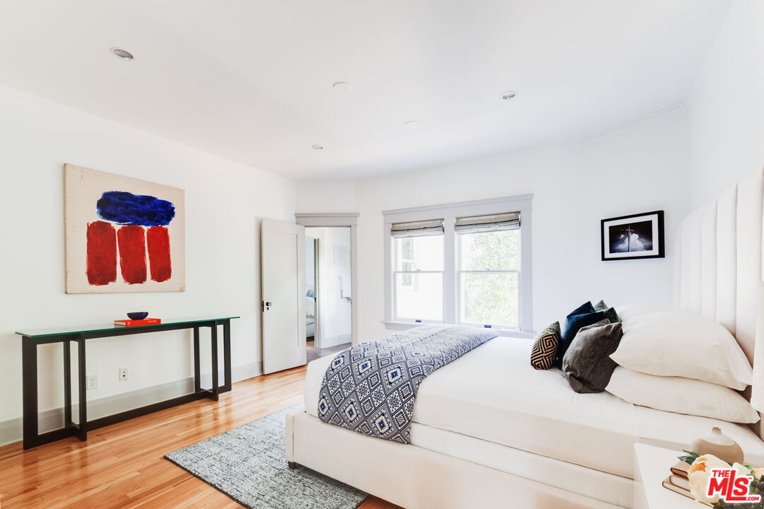 5850 Foothill Drive Los Angeles, CA 90068 - Photo 10 of 33 a bedroom with a bed and wooden floor