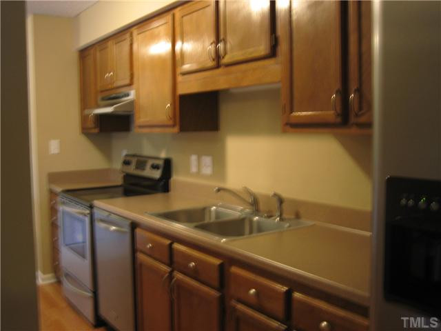 2030 Quaker Landing, Unit 201 Raleigh, NC 27603 - Photo 9 of 12 Another shot of this awesome kitchen, tons of cabinet and counter top space! Really all you need is your duffle bag and toothbrush, Immaculate. Oh dont forget the new heat pump that was just installed to keep you cool on these hot hazy nights. Kitchen