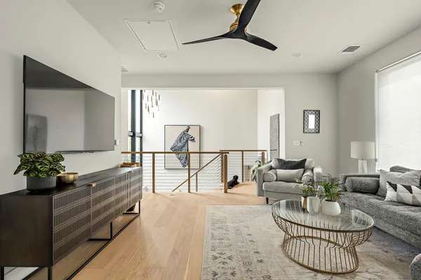 a living room with furniture potted plant and a window