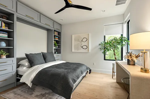 a bedroom with a large bed and a window