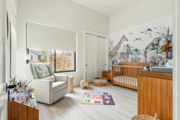 a bedroom with furniture and a window