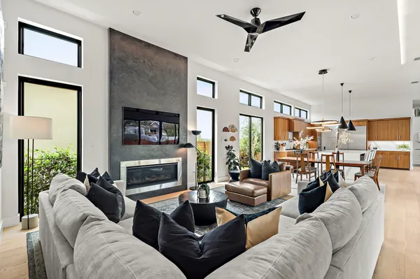 a living room with furniture and a fireplace