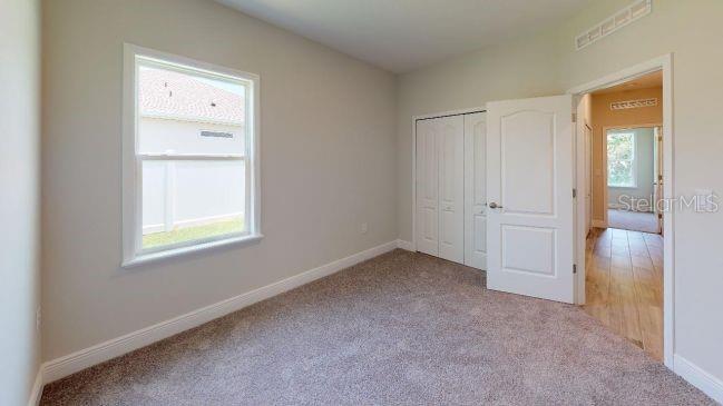 Tbd Mohawk Road Venice, FL 34293 - Photo 12 of 16 an empty room with windows and closet