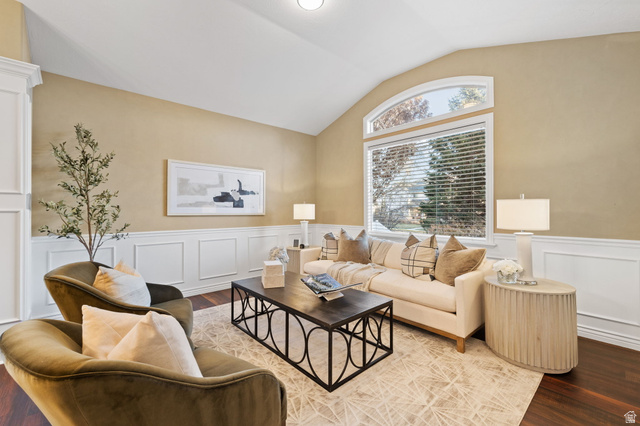 6208 West Bull River Road Highland, UT 84003 - Photo 5 of 90 Living area featuring a vaulted ceiling and rich wood-finish flooring