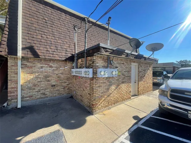 a view of a patio with a table and chairs