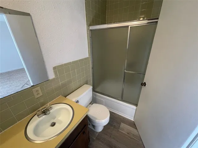 a bathroom with a sink and toilet