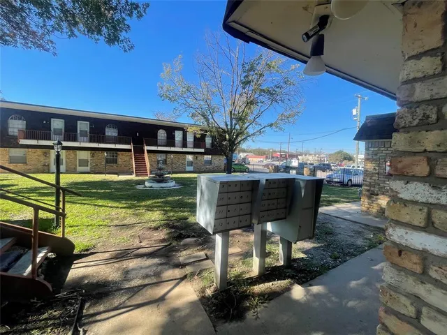 a view of a house with backyard porch and sitting area
