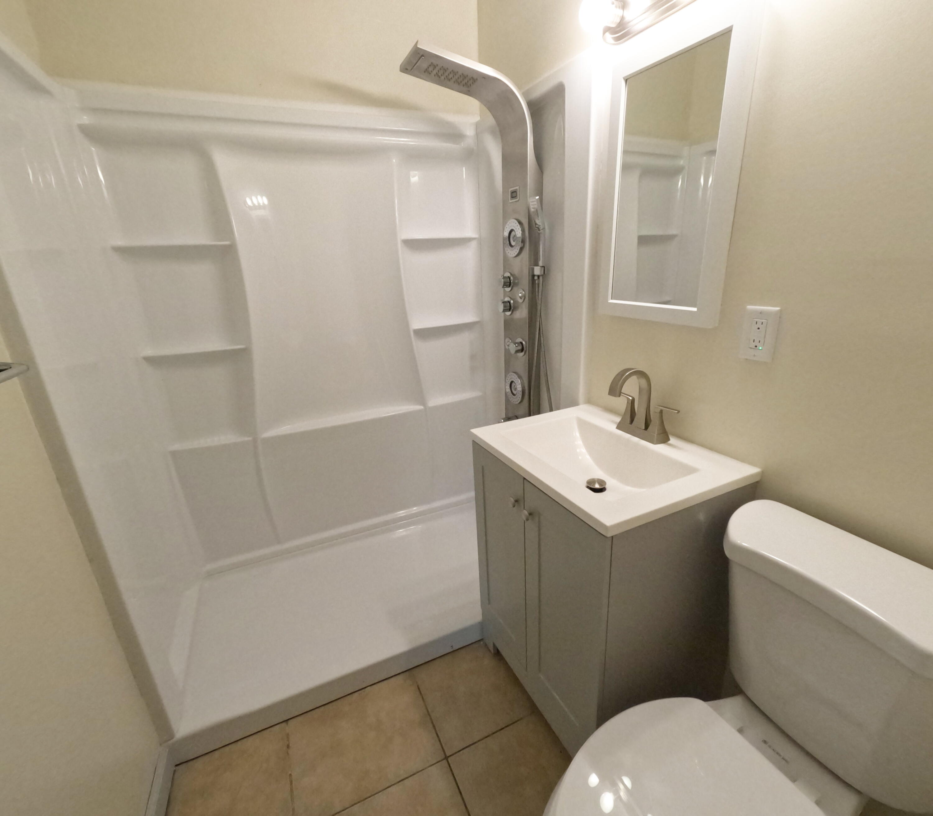 403 South 14th Street Fort Pierce, FL 34950 - Photo 15 of 19 a bathroom with a sink a toilet and shower