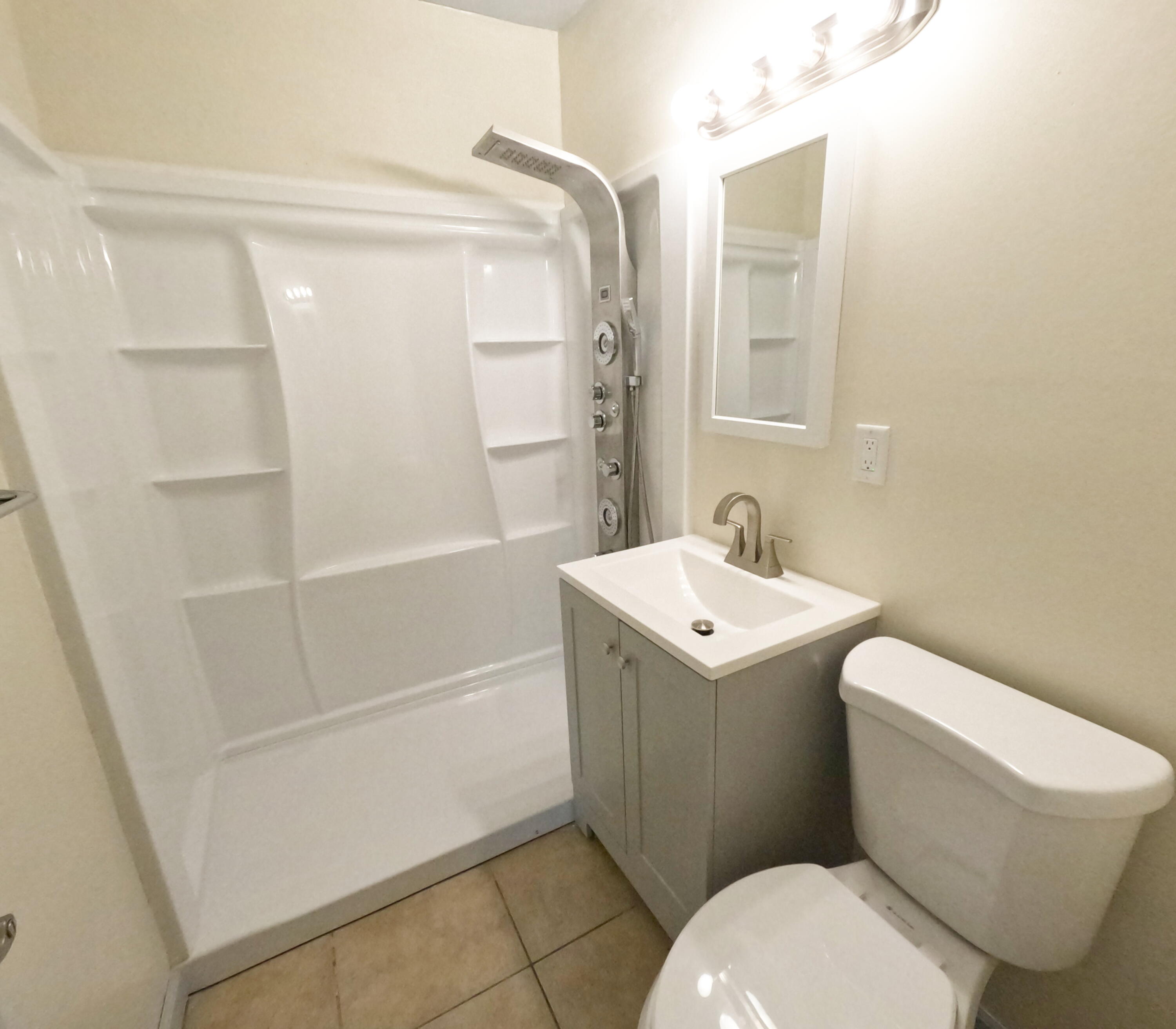 403 South 14th Street Fort Pierce, FL 34950 - Photo 16 of 19 a bathroom with a sink a toilet and shower