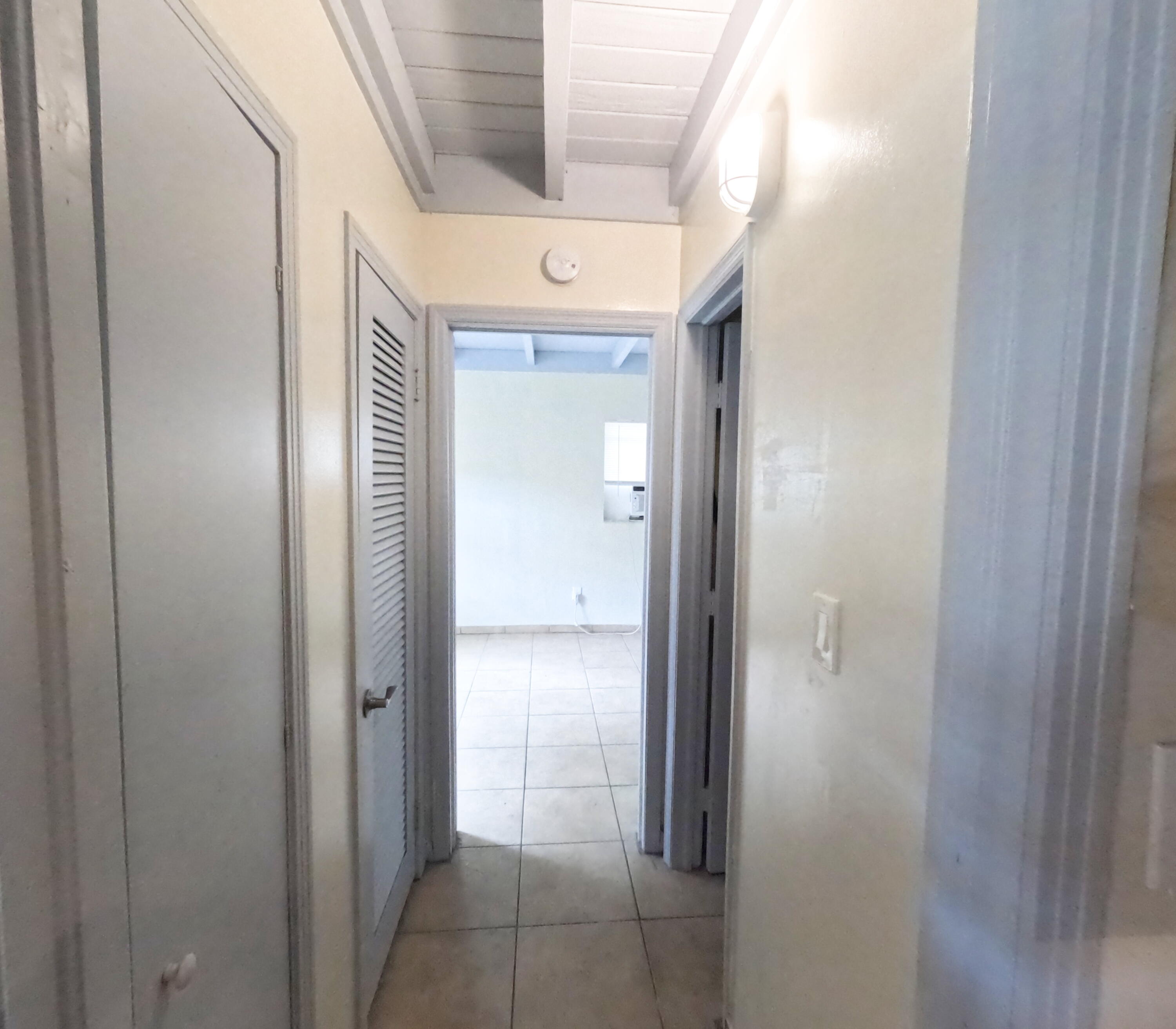403 South 14th Street Fort Pierce, FL 34950 - Photo 17 of 19 a view of a hallway with a glass door and a window