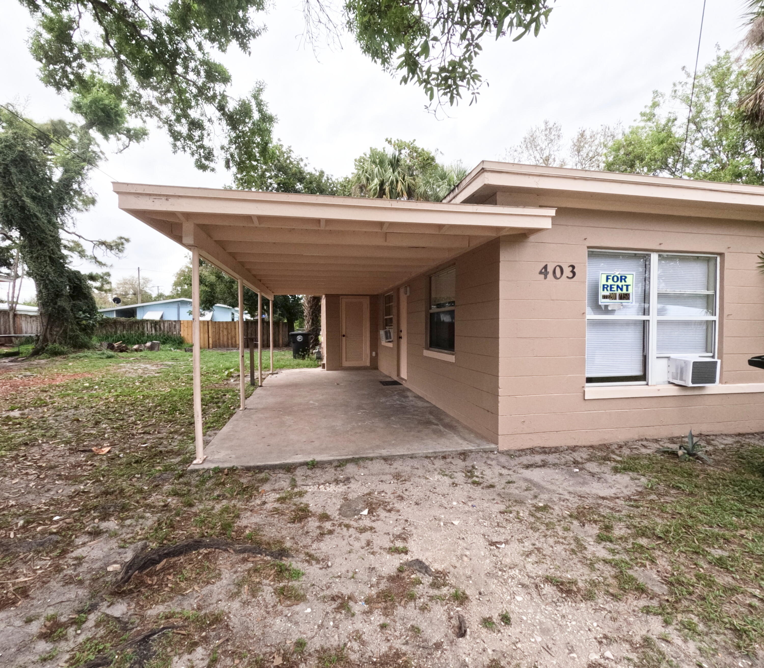 403 South 14th Street Fort Pierce, FL 34950 - Photo 2 of 19 a view of a house with backyard and porch