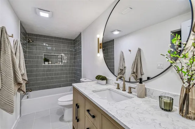 a living room with furniture a table and a large window