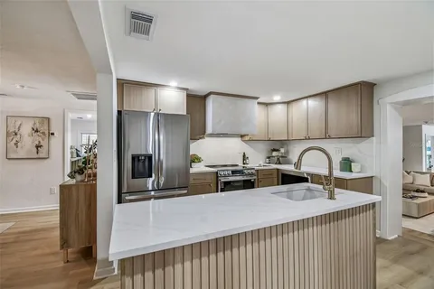 a kitchen with a stove microwave and refrigerator