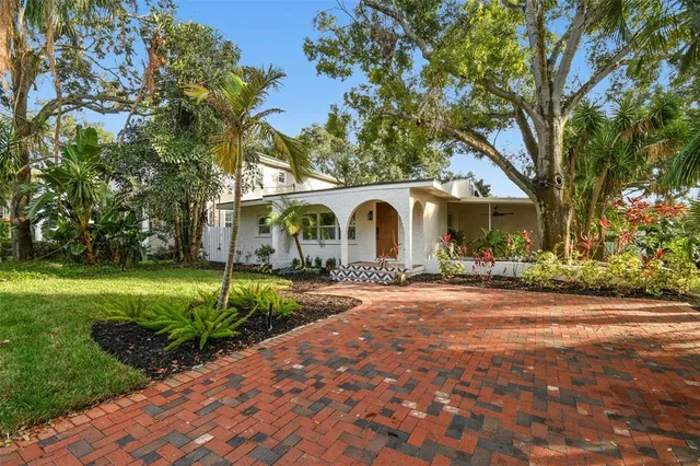a front view of house with yard and outdoor seating