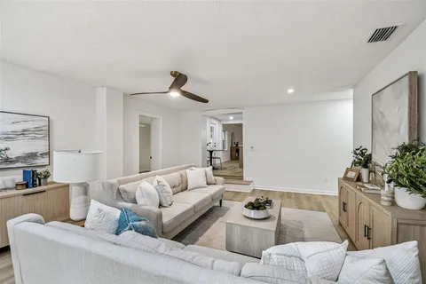 a spacious bathroom with a double vanity sink a mirror and shower