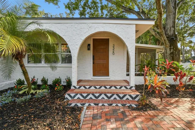 a dining room with furniture window and wooden floor