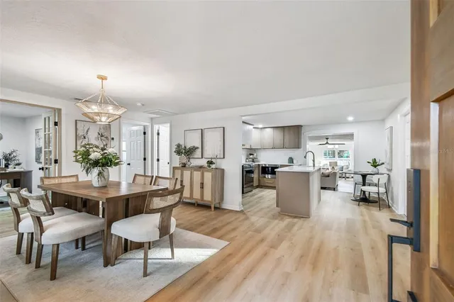 a view of a dining room with furniture window and outside view