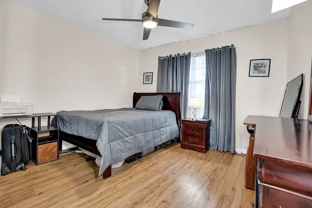 a bathroom with a sink a toilet and a shower
