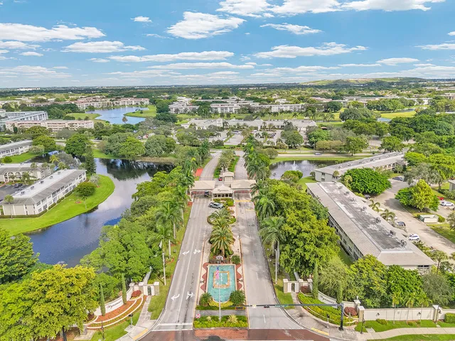an aerial view of residential houses with outdoor space and street view