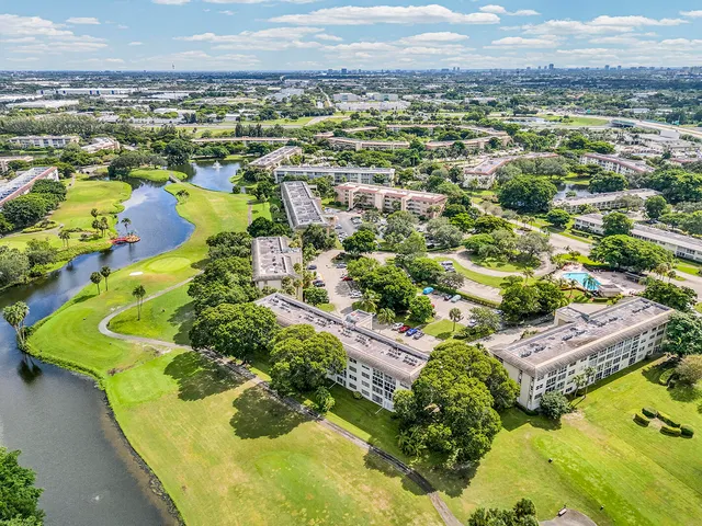 an aerial view of a house with a swimming pool