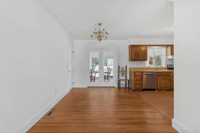 a view of a kitchen with microwave and cabinets