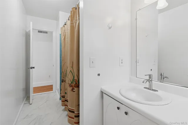 a bathroom with a sink and a mirror