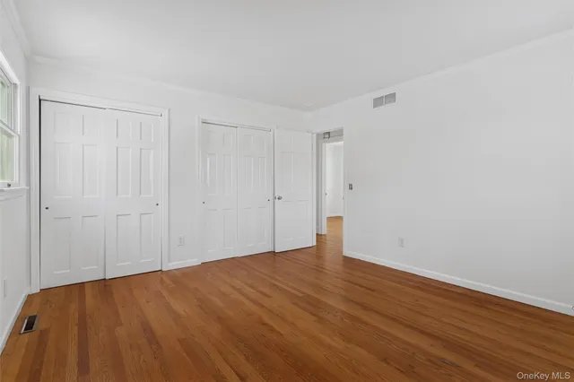 a bedroom with a bed and a chair