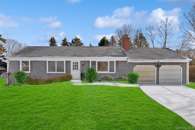 a backyard of a house with wooden floor table and chairs