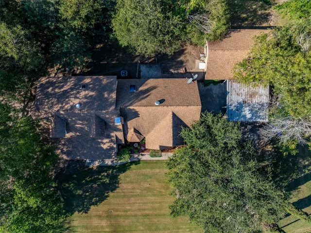 an aerial view of a house with a garden