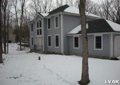 a front view of a house with yard