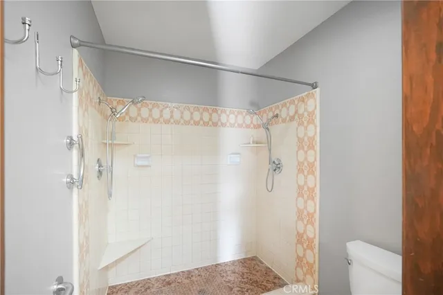 a bathroom with a glass shower door