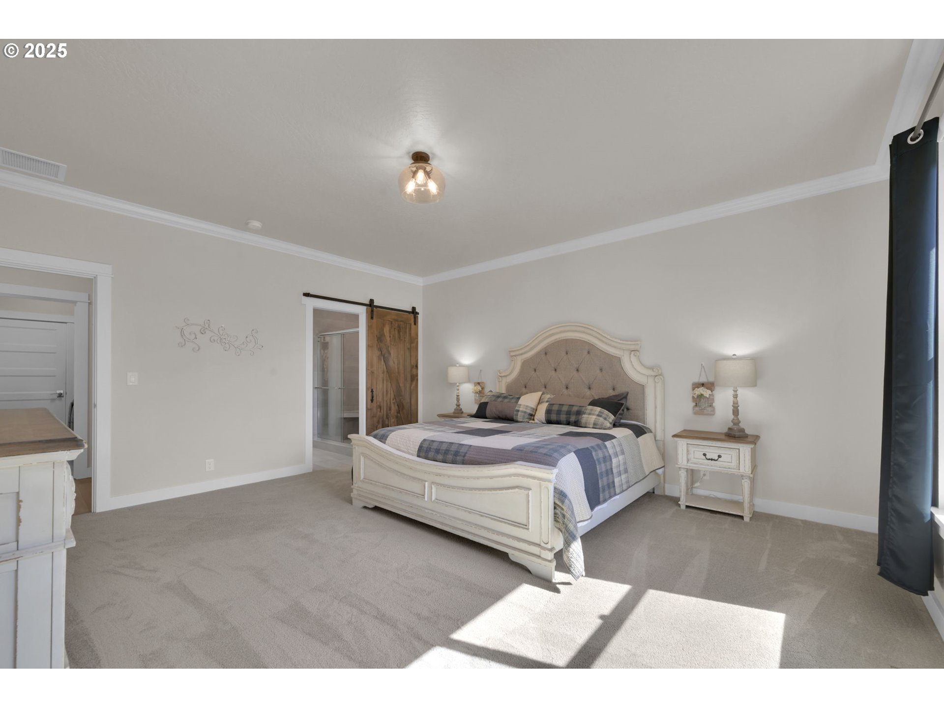 1004 South 46th Street Springfield, OR 97478 - Photo 16 of 34 a bedroom with a bed and a chandelier