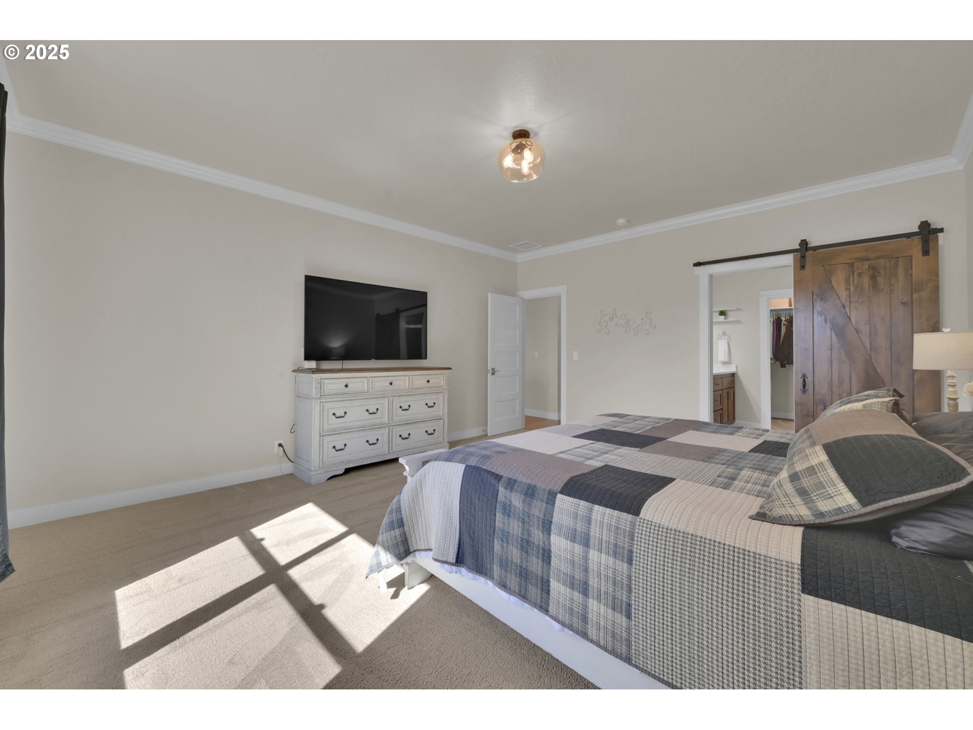 1004 South 46th Street Springfield, OR 97478 - Photo 17 of 34 a bedroom with a bed and a flat screen tv