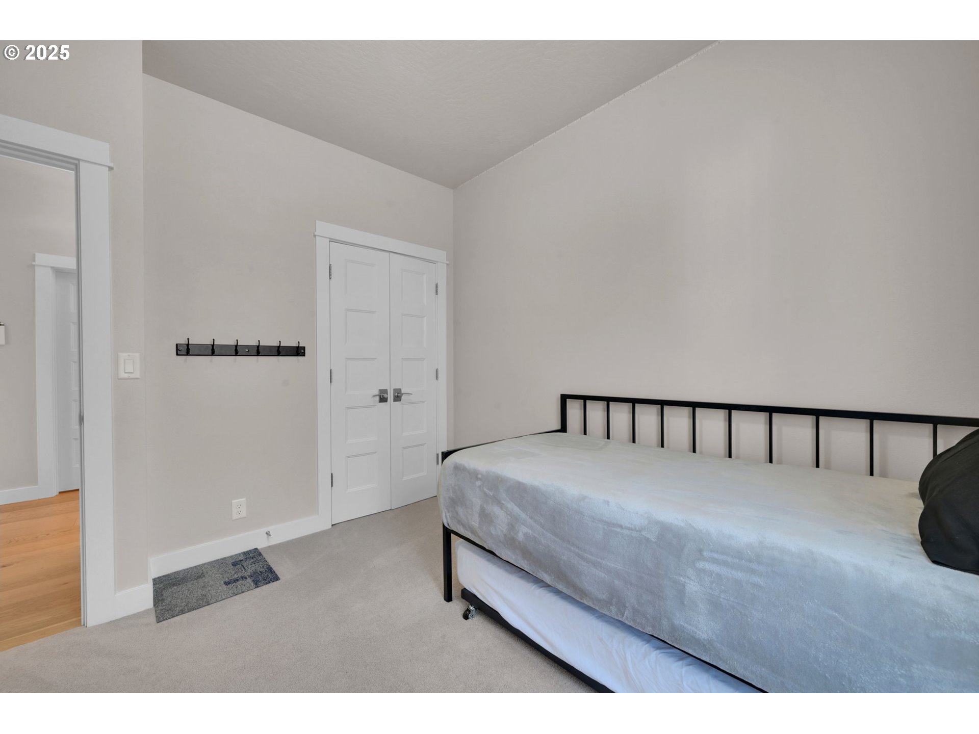 1004 South 46th Street Springfield, OR 97478 - Photo 25 of 34 a large bed sitting in a bedroom next to a window