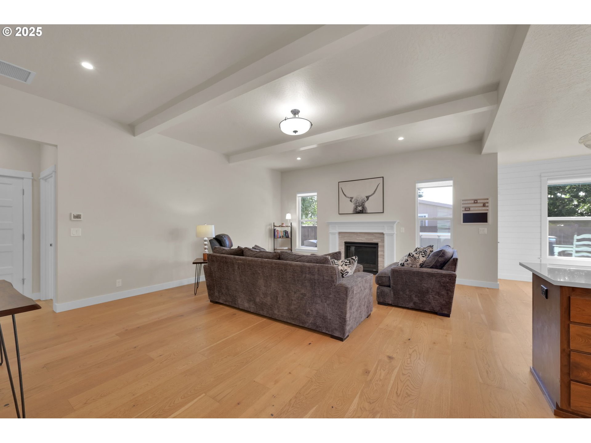 1004 South 46th Street Springfield, OR 97478 - Photo 5 of 34 a living room with furniture a fireplace and a flat screen tv