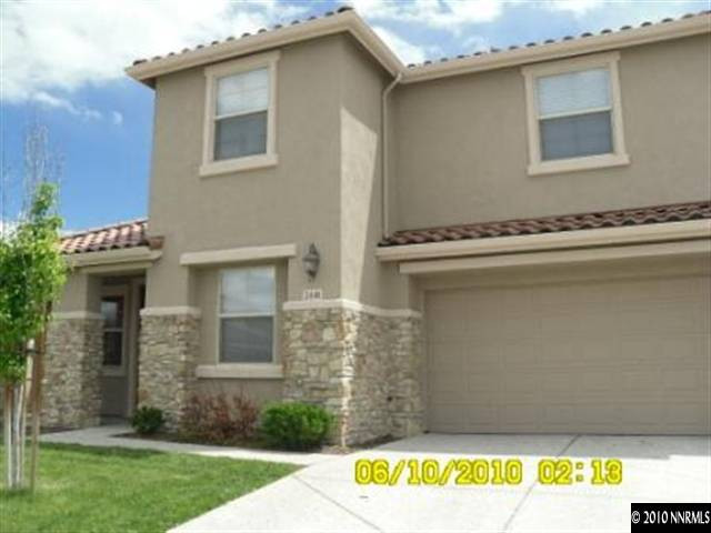 2448 Spring Flower Drive Reno, NV 89521 - Photo 1 of 9 a front view of a house with a yard