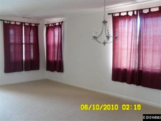 2448 Spring Flower Drive Reno, NV 89521 - Photo 6 of 9 a view of a hardwood & door