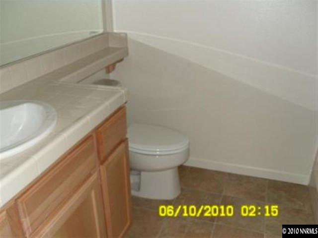 2448 Spring Flower Drive Reno, NV 89521 - Photo 8 of 9 a bathroom with a toilet and a sink