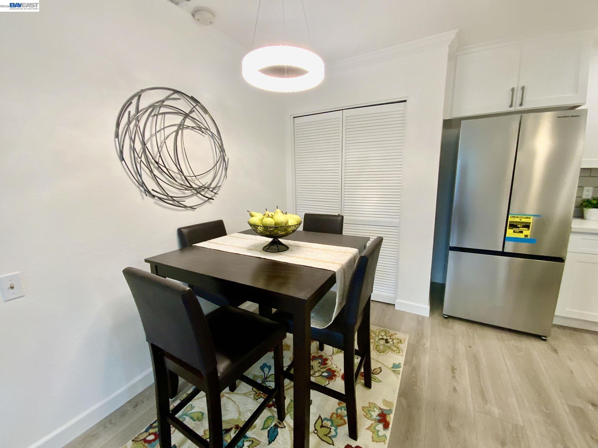 304 Hackamore Lane Fremont, CA 94539 - Photo 11 of 45 a view of a dining room with furniture and a chandelier