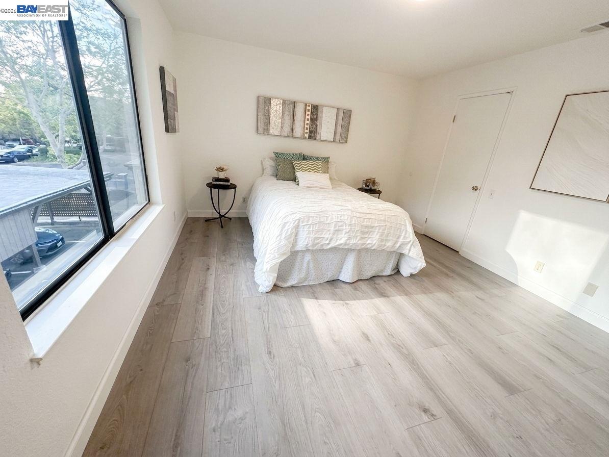 304 Hackamore Lane Fremont, CA 94539 - Photo 14 of 45 a bedroom with a bed and a large window