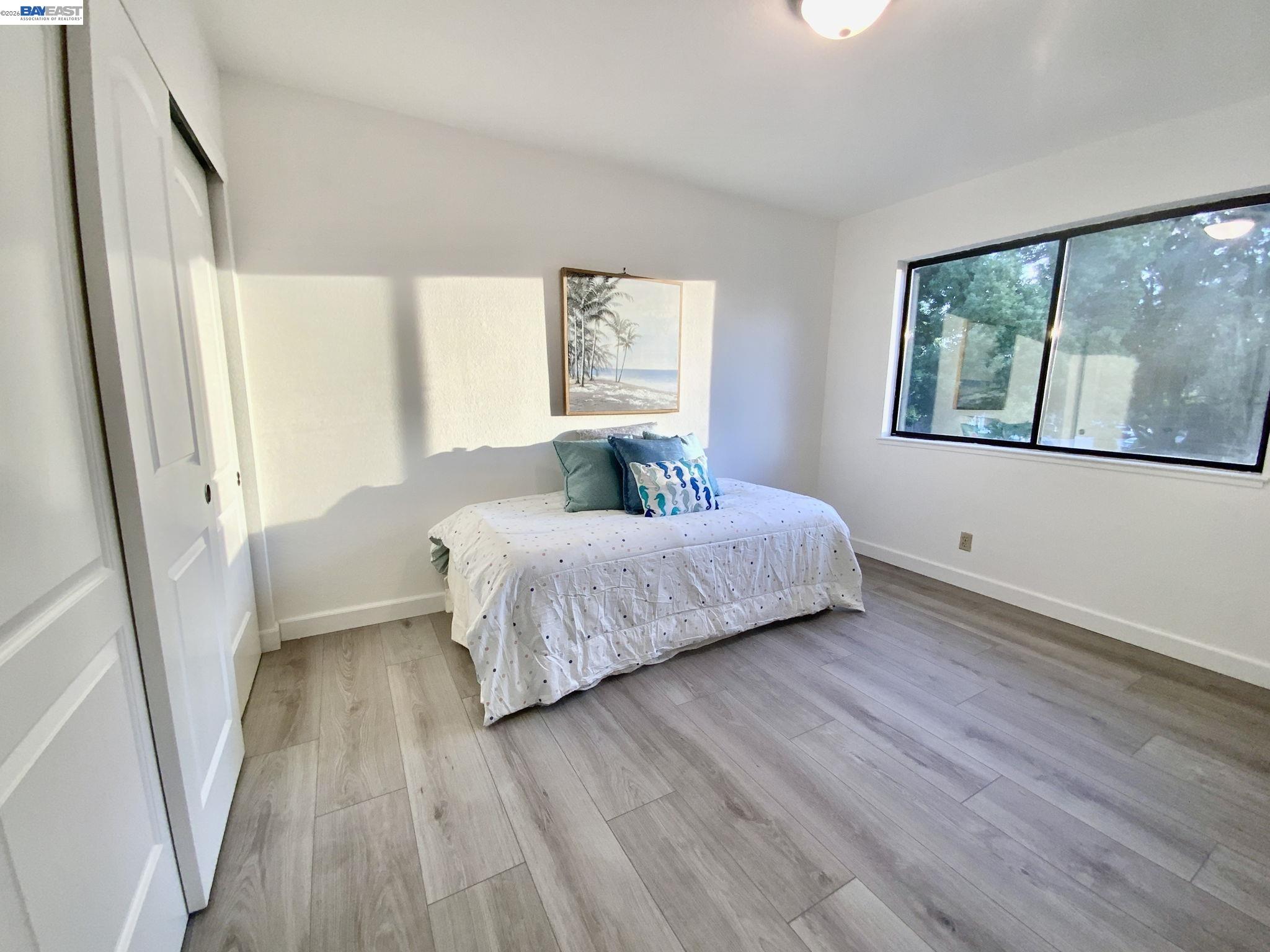 304 Hackamore Lane Fremont, CA 94539 - Photo 15 of 45 a bedroom with a bed and a large window