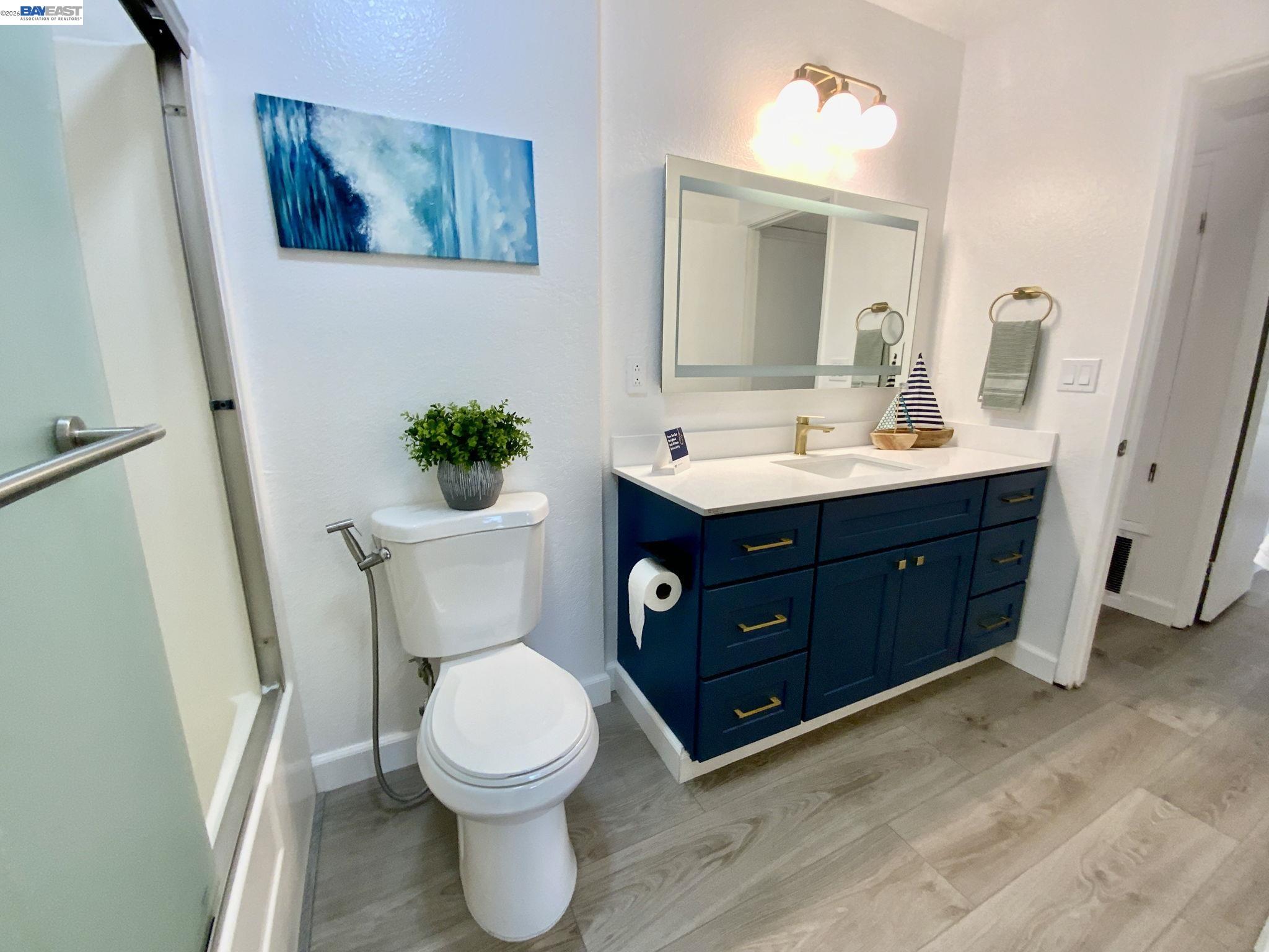 304 Hackamore Lane Fremont, CA 94539 - Photo 17 of 45 a bathroom with a toilet sink and mirror